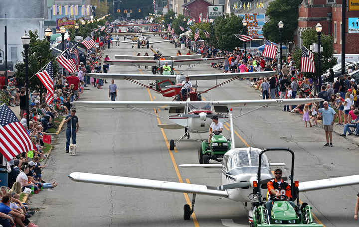 The 14th annual Heritage of Flight Festival got started with the Parade of Airplanes down Main Street in New Carlisle.  (Bill Lackey / Springfield News-Sun)